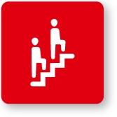 Slika dveh ljudi, ki hodita po stopnicah, na rdečem ozadju